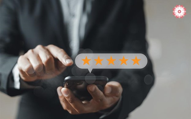 A Man Hand Pressing On Smartphone Screen With Gold Five Star Rating Feedback