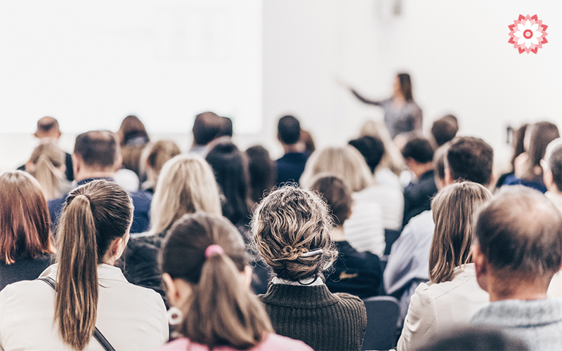Professionals attending a training session in a conference room